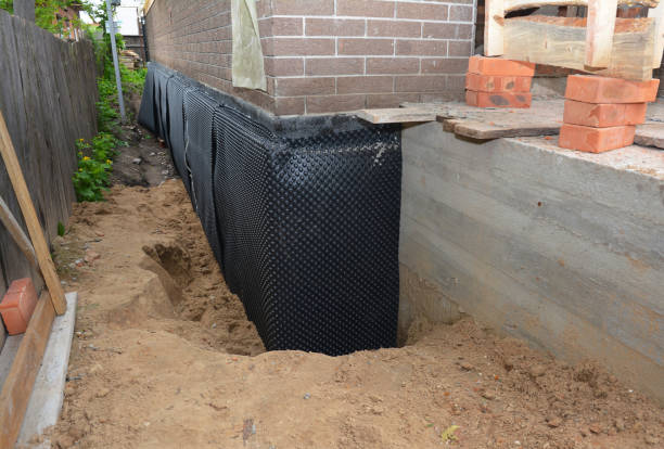 SJ Waterproofing Pros technician performing targeted Sump Pump Installation assessment in Allardt, TN